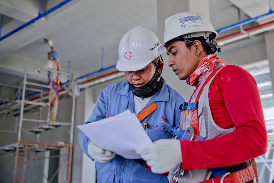 Engineers reviewing plans on site